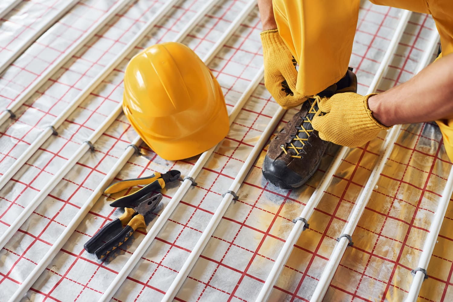 worker in yellow colored uniform installing underf 2021 09 02 23 54 09 utc